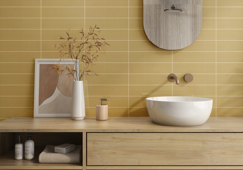 HAVANA yellow ceramic wall tile behind a wood bathroom vanity